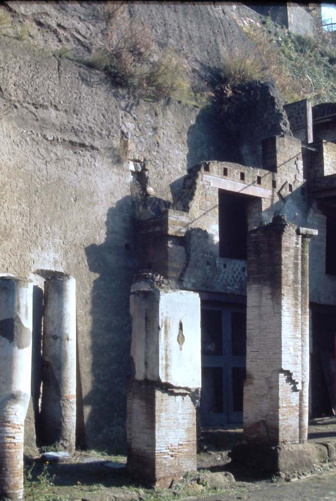 Decumanus Maximus, Herculaneum, north side. 4th December 1971.
Looking towards north side of roadway, with doorway numbered 1, on right behind pillar.
Photo courtesy of Rick Bauer, from Dr George Fay’s slides collection.